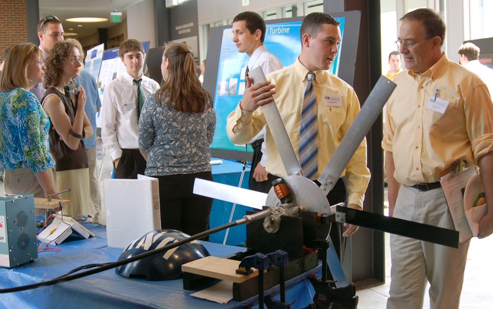 Students explain their research projects to attendees and judges at the Interdisciplinary Science & Engineering symposium