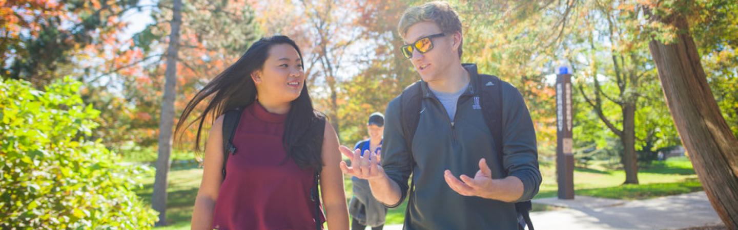Image of two students on campus