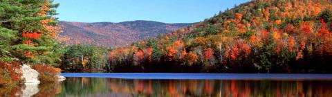 Scenic fall foliage with mountains and a lake