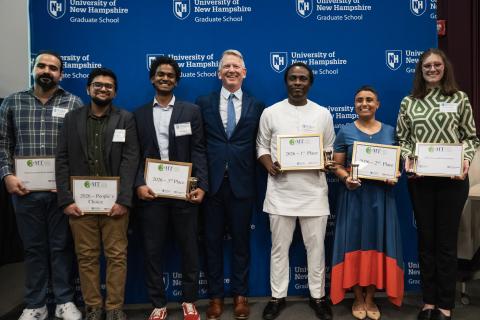 3MT winners posing with their awards